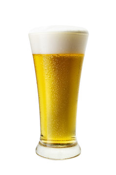 Glass of cool light beer with froth isolated on white background