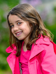 Fototapeta premium Natural portrait of a happy pretty little girl