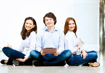 Three students smiling