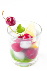 Refreshing summer drink with mint, cherry, lemon and ice