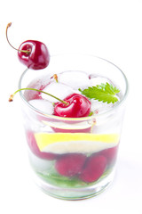 Refreshing summer drink with mint, cherry, lemon and ice