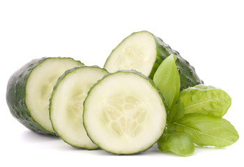 Sliced cucumber vegetable and basil leaves still life