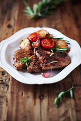 Grilled pork steaks with grilled vegetables