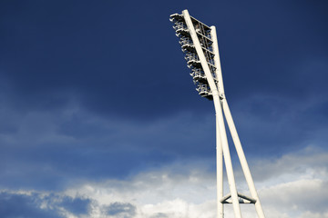 Stadium Lighting Tower and Cloudy Sky