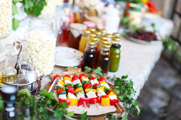 Vegetable skewers with cheese, popcorn at the picnic