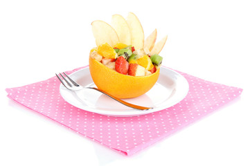 Fototapeta na wymiar Fruit salad in hollowed-out orange isolated on white