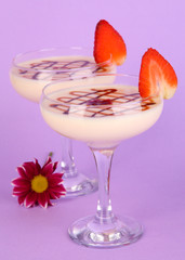 Fruit smoothies on lilac background