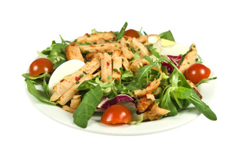 Salad with strips of spicy chicken on a white background.