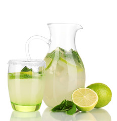 Lemonade in pitcher and glass isolated on white