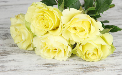 Beautiful bouquet of roses on table close-up