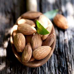 Almonds on a wooden spoon
