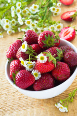 Fresh strawberry in the white bowl