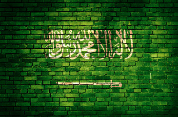 Saudi Arabia flag on brick wall