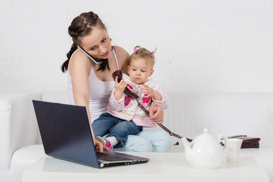 Mother And Baby With Phone.