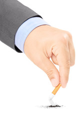 Male hand quitting smoking cigarette
