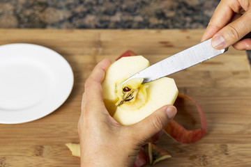 Removing Pit from Apple with Knife