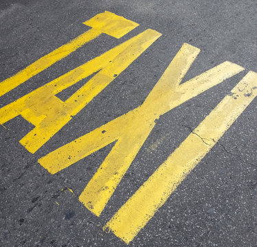 Taxi sign on street