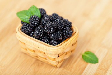 Fresh Blackberries in basket on white