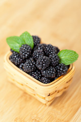 Fresh Blackberries in basket on white