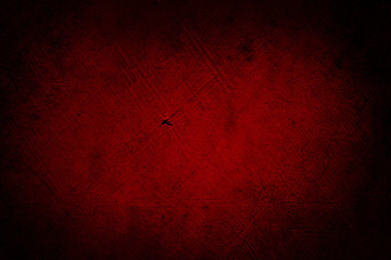Fototapeta premium Red textured concrete wall background. Dark edges