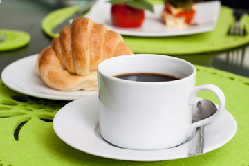 Coffee cup and Croissants