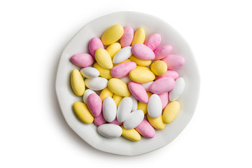 sugared almonds on ceramic plate