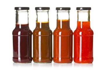 Gardinen various barbecue sauces in glass bottles © Jiri Hera