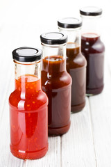 various barbecue sauces in glass bottles