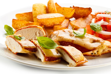 Grilled chicken breasts with cheese and baked potatoes