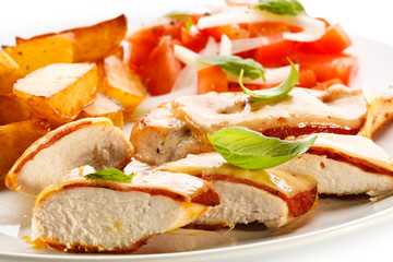 Grilled chicken breasts with cheese and baked potatoes