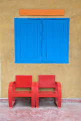 red chairs on brick wall
