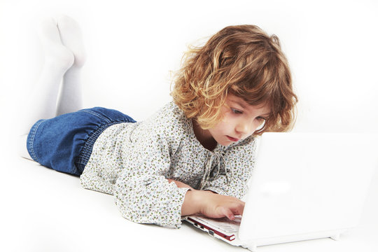 Little girl using laptop
