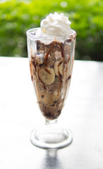 A delicious chocolate ice cream sundae isolated on white