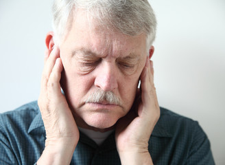senior with pain in front of ears