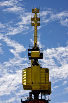 sky clouds and yellow crane in  buenos aires