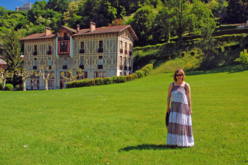 Woman on lawn of spa hotel #2