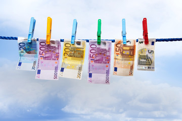 Banknotes hanging on a clothesline