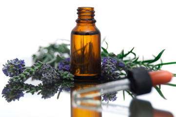 Essential oil bottle with lavender flowers and rosemary - 53083400