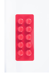 Tablet in red blister pack