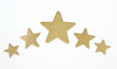 Fototapeta na wymiar Gold stars on the white backgroung