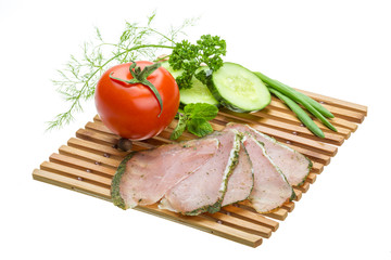 Ripe fresh ham with vegetables