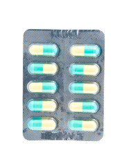 Green and yellow capsule in transparent blister pack