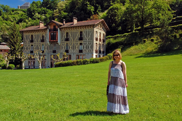 Woman on lawn of spa hotel