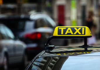 Taxi sign on car