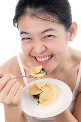 Happy Asian woman with smile face eating Pie