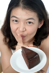 asian girl holding a chocolate cake