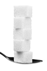 cube sugars in teaspoon isolated on white