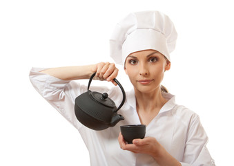 female cook / chef in uniform with teapot, isolated on white