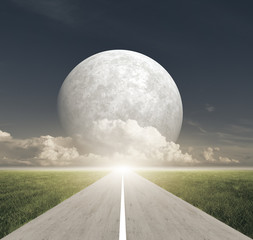 Road between meadow fields and Giant Moon with clouds at horizon - 53097649