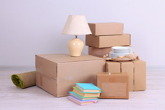 Moving boxes on the floor in empty room